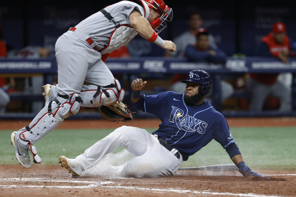 Tampa Bay Rays' Manuel Margot is forced out at home by St. Louis Cardinals catcher Andrew Knizner during the sixth inning of a baseball game Wednesday, June 8, 2022, in St. Petersburg, Fla. (AP Photo/Scott Audette)