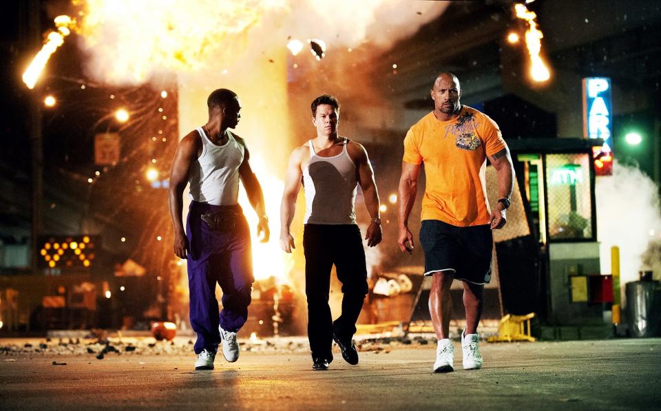 Anthony Mackie (far left), Mark Wahlberg and Dwayne Johnson are ex-con bodybuilders embroiled in some criminal escapades in "Pain & Gain."