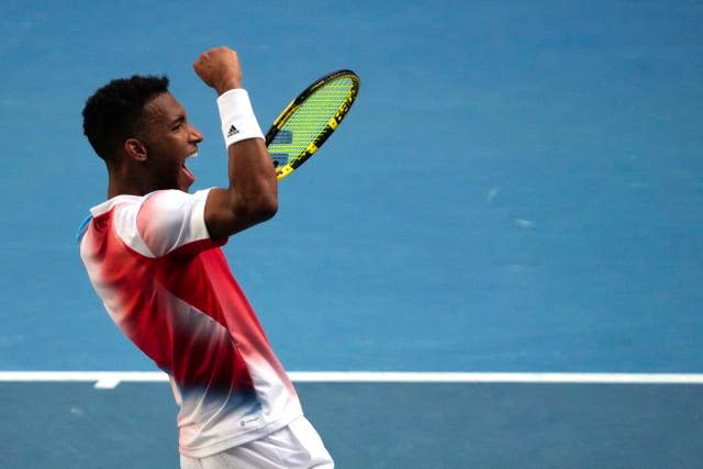 Felix Auger-Aliassime celebrates reaching the quarter-finals