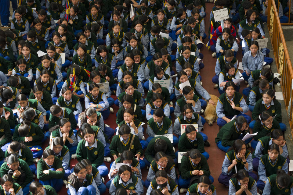 Exile Tibetan students listen to a speaker before joining a march to commemorate the 1959 uprising in Tibet on this day, in Dharamshala, India, Sunday, March 10, 2024. (AP Photo /Ashwini Bhatia)