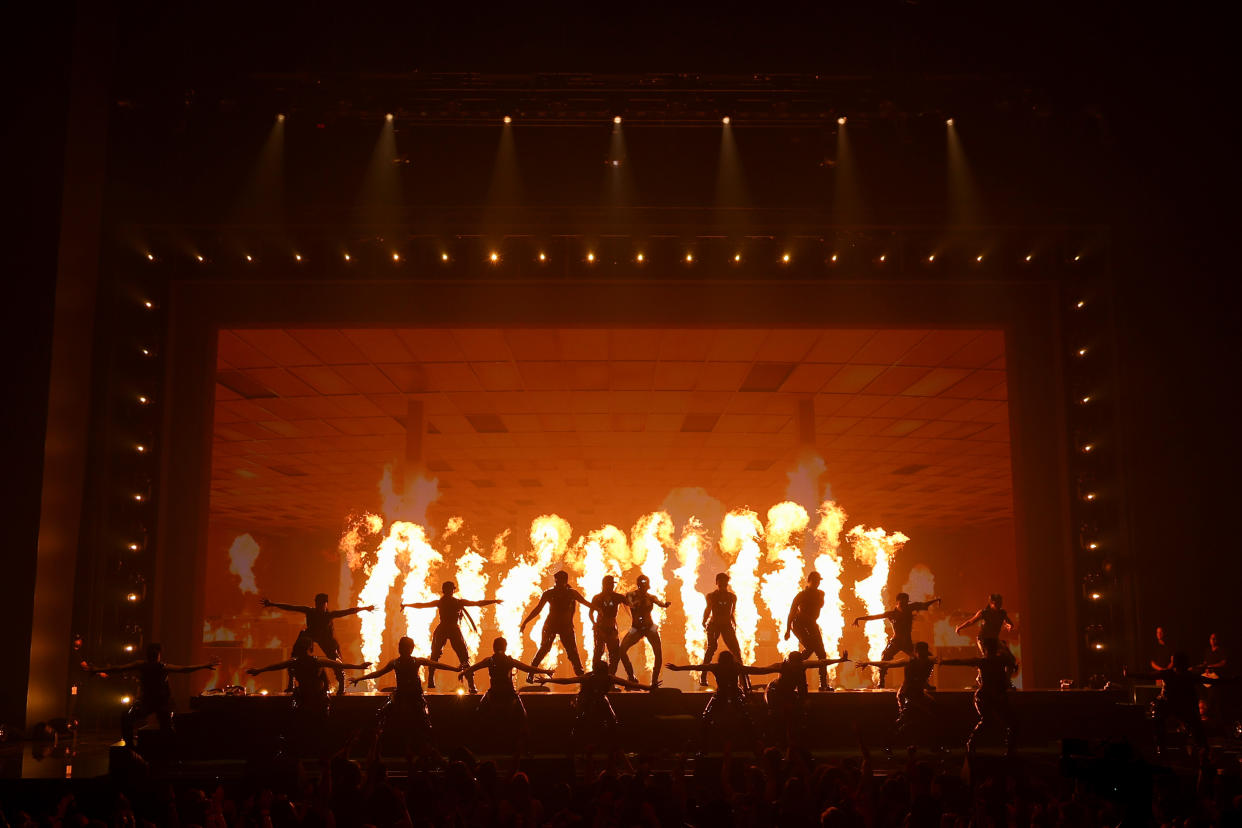 GloRilla performs on a stage made to look like a burning office.