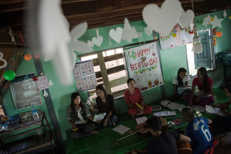 An interfaith group, comprising of Muslim and Catholic girls, practise singing Christmas carols in Kawkareik, Myanmar's Karen State