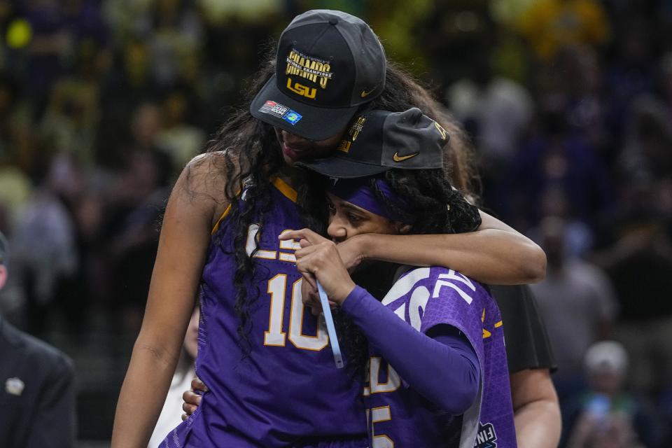 LSU's Angel Reese and Alexis Morris celebrate after the NCAA Women's Final Four championship basketball game Sunday, April 2, 2023, in Dallas. LSU won 102-85 to win the championship. (AP Photo/Darron Cummings)