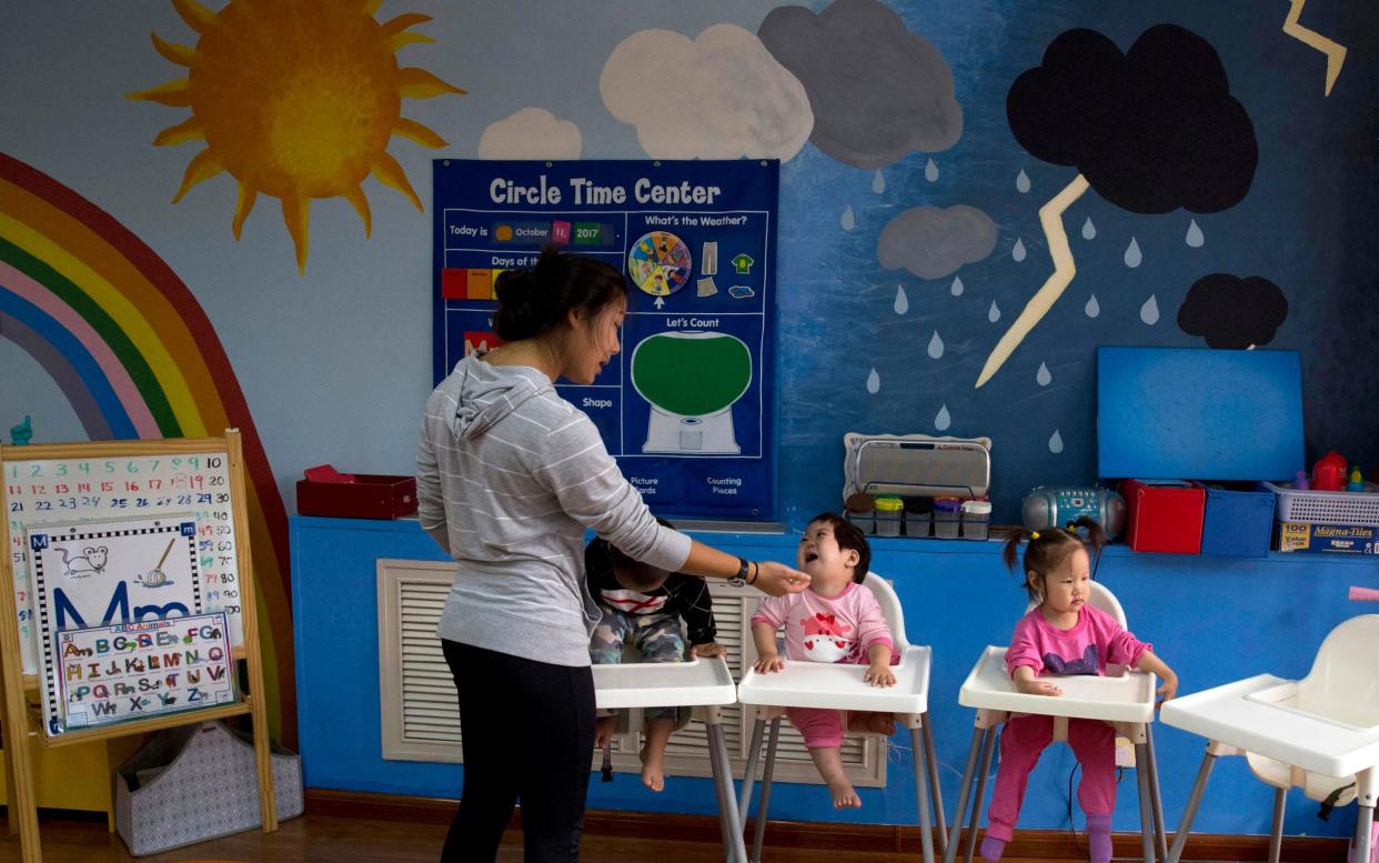 Children attend classes at a foster home of the New Hope Foundation on the outskirts of Beijing