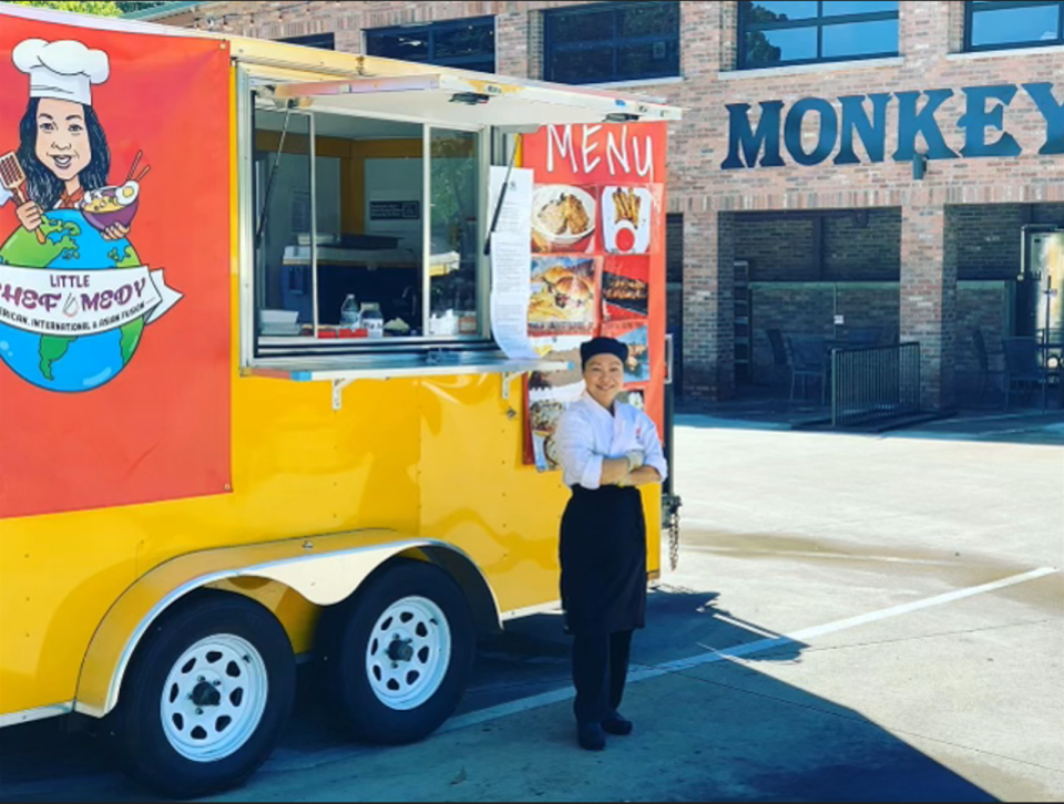 Remedy Stewart standing in front of her Little Chef Medy food truck.