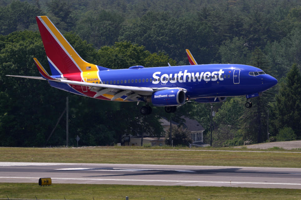 FILE - Southwest Airlines Boeing 737 lands at Manchester Boston Regional Airport, June 2, 2023, in Manchester, N.H. Southwest Airlines has adopted a ‘poison pill’ following activist investor Elliott Investment Management taking a significant stake in the company. The airline said Wednesday, July 3, 2024, that the shareholder rights plan is effective immediately and expires in a year. For any extension to occur, Southwest shareholders would need to give prior approval.(AP Photo/Charles Krupa, File)