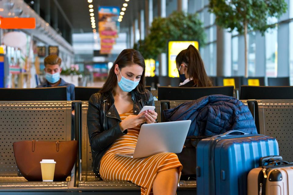 plane passenger sitting at an airport