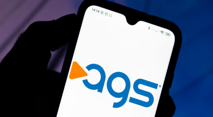 PlayAGS logo on a smartphone. AGS stock.