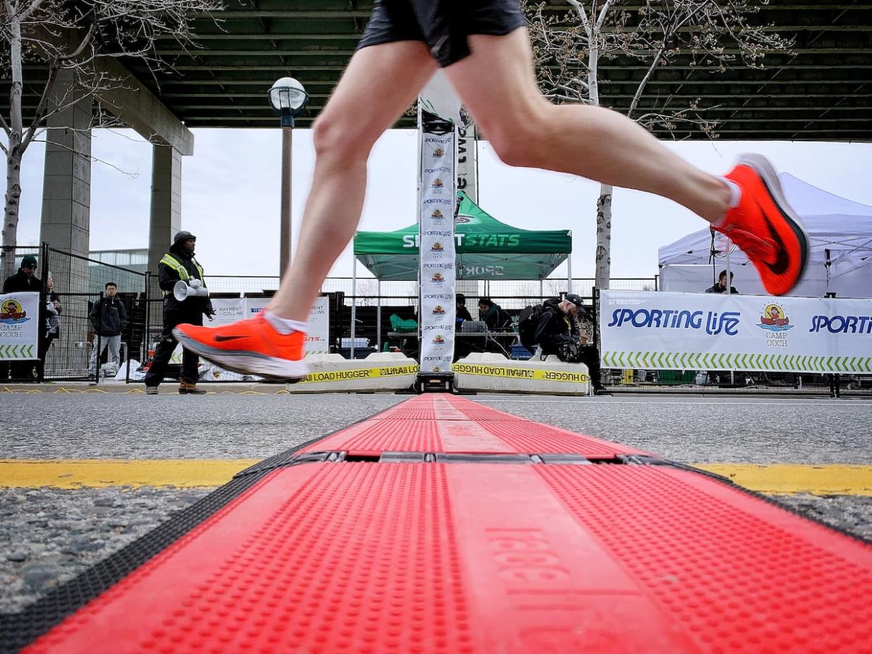 Toronto's annual Sporting Life 10K draws thousands of people on Mother's Day. The event winds through the city's downtown corridor, finishing at Fort York Boulevard and Lake Shore Boulevard W. (James Morrison-Collalto/CBC   - image credit)