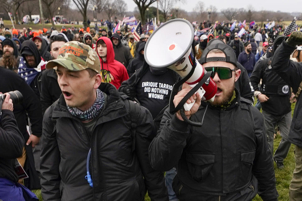 Proud Boys members Zachary Rehl and Ethan Nordean walk toward the U.S. Capitol in support of then-President Donald Trump on Jan. 6, 2021.