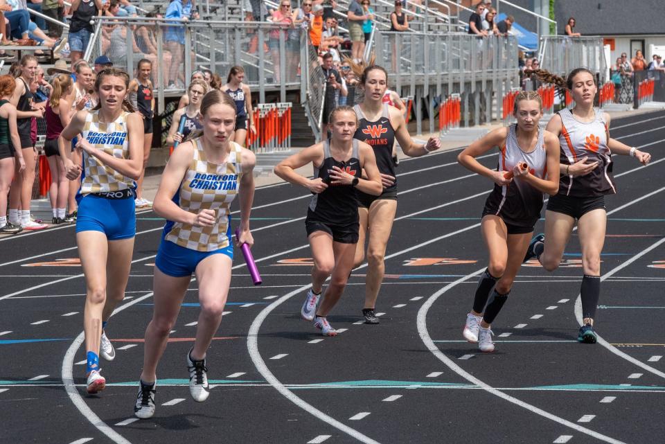 Relay runners from Rockford Christian, from left to right, Winnebago and Byron work themselves through the handoff zone during a relay race at the Class 1A Winnebago Sectional on Saturday, May 14, 2022.