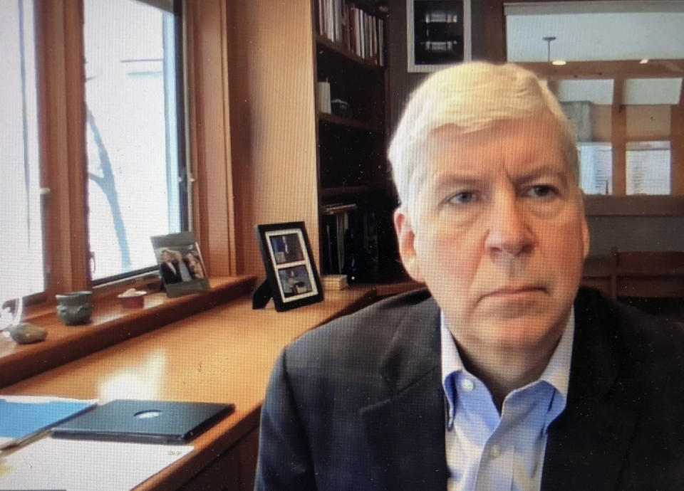 FILE - This screen shot from video, shows former Michigan Gov. Rick Snyder, during his Zoom hearing in the 67th District Court in Flint, Mich., on Jan. 18, 2020. A judge had no authority to issue indictments in the Flint water scandal, the Michigan Supreme Court said Tuesday, June 28, 2022 in an extraordinary decision that wipes out charges against former Gov. Snyder, his health director and seven other people (67th District Court in Flint via AP, file)