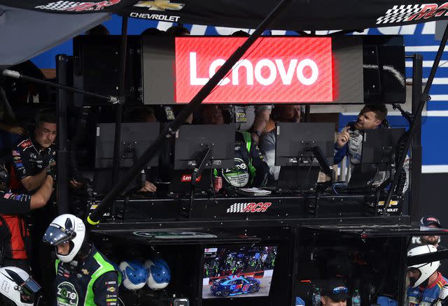 <p>James Gilbert/Getty </p> Ricky Stenhouse Jr. talks to his pit crew after the track incident