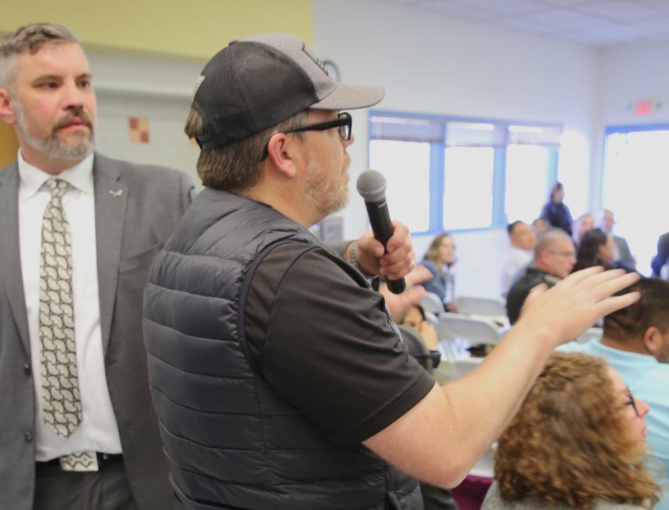 Farmington resident Danny Clugston poses a question to Gov. Michelle Lujan Grisham during a town hall meeting on Thursday, April 11 at Animas Elementary School.