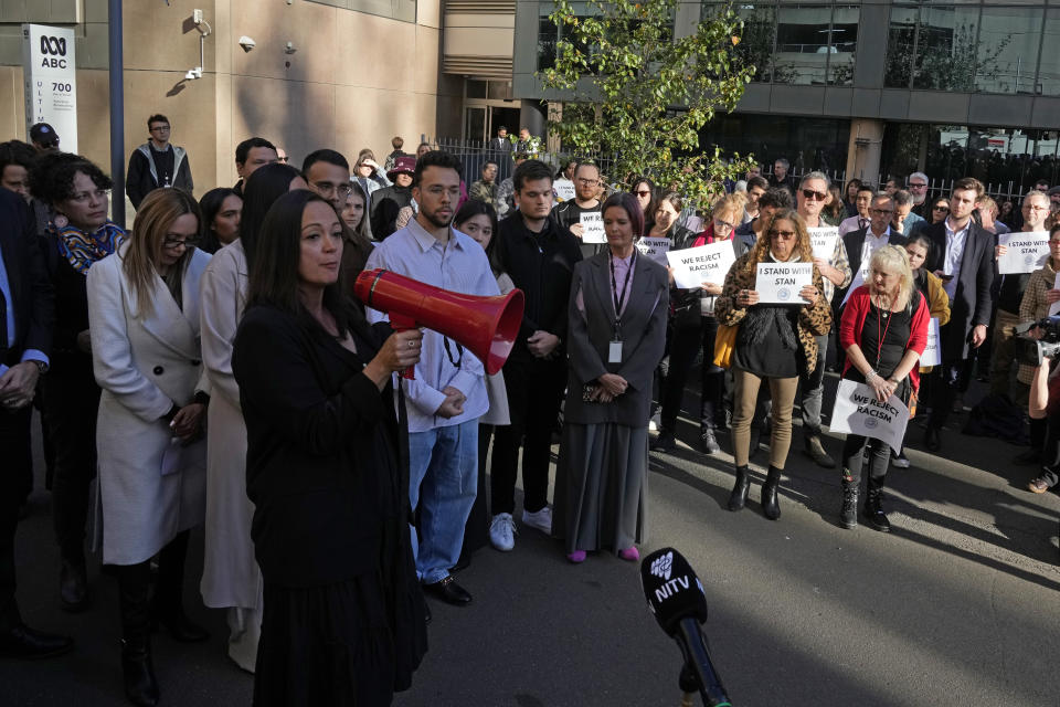 Australian Broadcasting Corp. (ABC) workers and other supporters gather at the ABC offices in Sydney, Monday, May 22, 2023, to support Indigenous journalist Stan Grant. Grant announced he would step away from television hosting duties after viewers responded with racist abuse to his comments during King Charles III's coronation about historic Aboriginal dispossession. (AP Photo/Rick Rycroft)