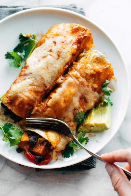 <p>Pinch of Yum</p><p>Easy veggie enchiladas that are saucy, cheese, filling, cozy and packed with any roasted veggies you want. Super versatile and easy to make!</p><p><strong>Get the recipe: <a href="https://pinchofyum.com/easy-veggie-enchiladas" rel="nofollow noopener" target="_blank" data-ylk="slk:Easy Veggie Enchiladas;elm:context_link;itc:0;sec:content-canvas" class="link ">Easy Veggie Enchiladas</a></strong></p>