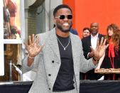 Kevin Hart shows his cement-covered hands at his hand and footprint ceremony at Grauman's Chinese Theatre in Hollywood on Tuesday.