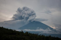 <p>Black smoke ash seen in the top of Mount Agung on November 28, 2017 in Bali, Indonesia. More than 100,000 villagers will need to leave the expanded danger zone while tens of thousands of tourists have been stranded due to airport closures. (Photo: Solo Imaji / Barcroft Media via Getty Images) </p>