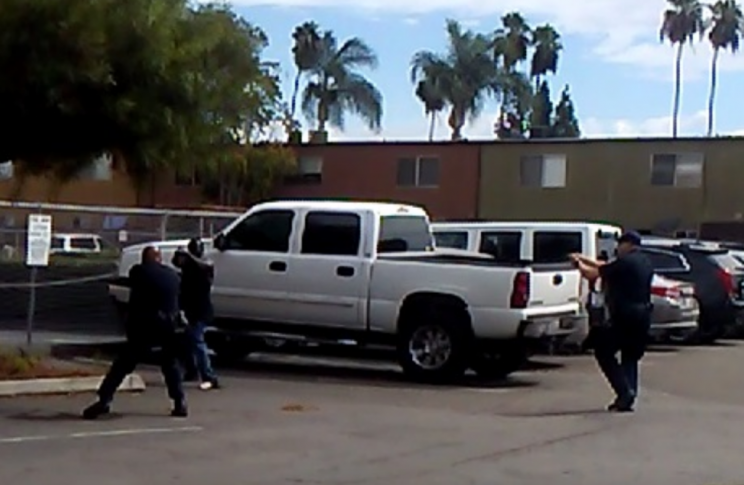 El Cajon shooting of black man: Still frame of confrontation from witness video. 