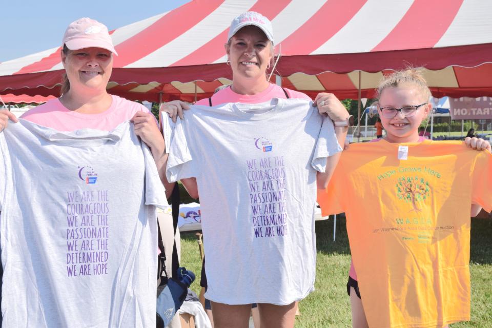 Members of "The Bravehearts" show off T-shirts they picked up Saturday at Greencastle, Pa.'s Relay for Life. From left are Sharon Zeis, Angie Maynard and Lakelyn Maynard.