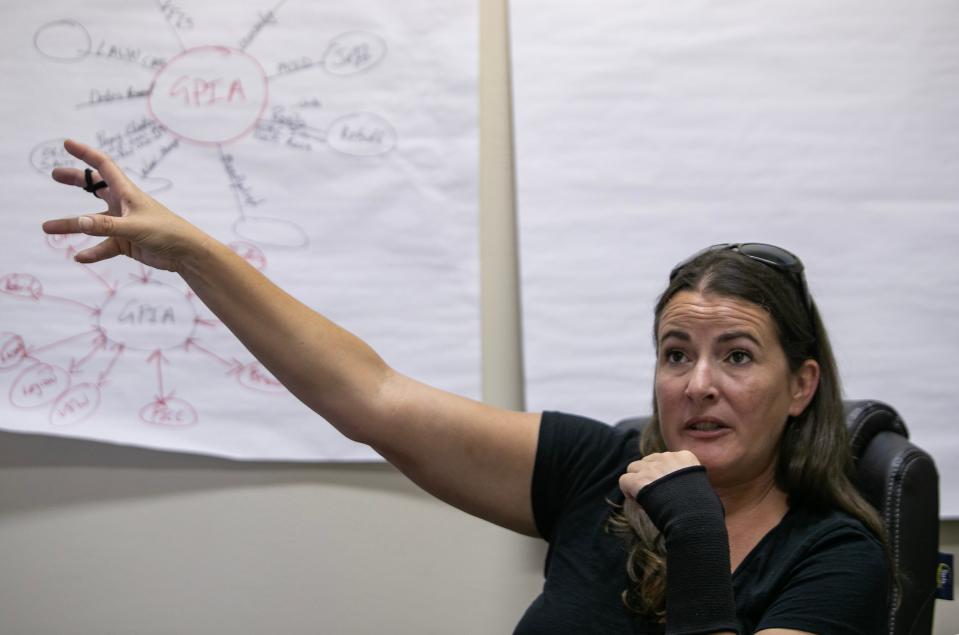 Erin Lollar-Lambert, executive director of the Greater Pine Island Alliance, speaks with a reporter from the USA TODAY Network Tuesday, August 29, 2023.