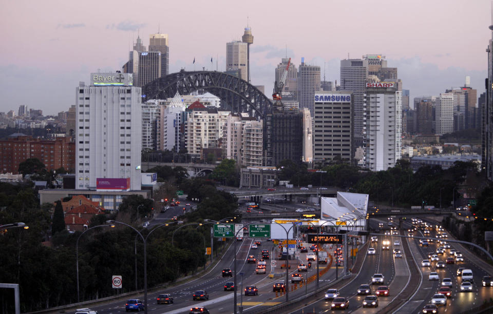 A picture of a busy northern Sydney road with the CBD's skyline in the background.