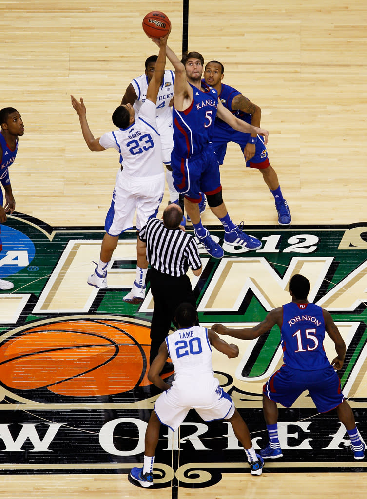 Jeff Withey #5 of the Kansas Jayhawks and Anthony Davis #23 of the Kentucky Wildcats tip the ball off to start the National Championship Game of the 2012 NCAA Division I Men's Basketball Tournament at the Mercedes-Benz Superdome on April 2, 2012 in New Orleans, Louisiana. (Photo by Chris Graythen/Getty Images)