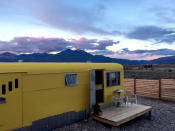 <h2>Taos Ski Valley, New Mexico</h2> <p>Ski bunnies who don't mind close quarters will love <a rel="nofollow noopener" href="https://www.airbnb.com/rooms/9697385?location=Taos%20Ski%20Valley%2C%20NM%2C%20United%20States&s=oE2Mwj9Z" target="_blank" data-ylk="slk:this vintage trailer's;elm:context_link;itc:0;sec:content-canvas" class="link ">this vintage trailer's</a> close proximity to all of Taos Ski Valley's outdoor activities, not to mention it's surrounded by breathtaking mountain views. Both the decor and the appliances have been updated, and guests can enjoy an outdoor fire pit and deck for some epic stargazing.</p> <h4>Airbnb</h4>