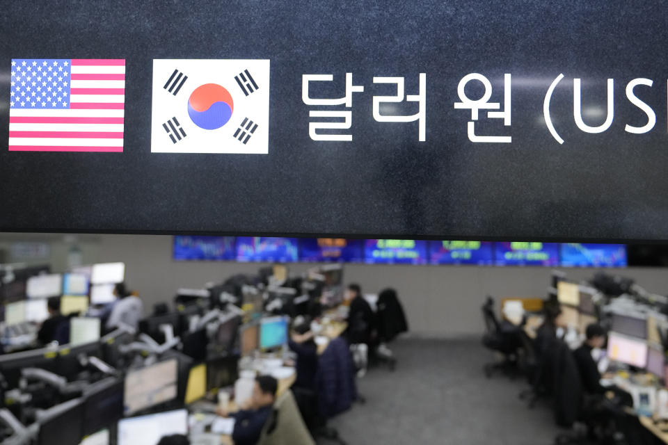 FILE - The screen showing the foreign exchange rate between U.S. dollar and South Korean won is seen at a foreign exchange dealing room in Seoul, South Korea, Friday, Nov. 17, 2023. Shares were mostly lower in Asia on Thursday, Nov. 23, after a modest advance on Wall Street that kept the market on track for a fourth straight weekly gain.(AP Photo/Lee Jin-man, File)