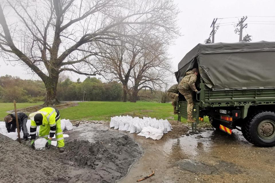 Members of the New Zealand defence force provide support in Westport (Reuters)