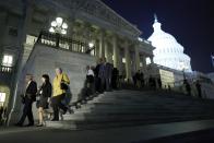 Members of the U.S. House of Representatives depart after a late-night vote on fiscal legislation to end the government shutdown, at the U.S. Capitol in Washington, October 16, 2013. The U.S. Congress on Wednesday approved an 11th-hour deal to end a partial government shutdown and pull the world's biggest economy back from the brink of a historic debt default that could have threatened financial calamity. REUTERS/Jonathan Ernst (UNITED STATES - Tags: POLITICS BUSINESS)