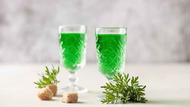 Two glasses absinthe with sugar