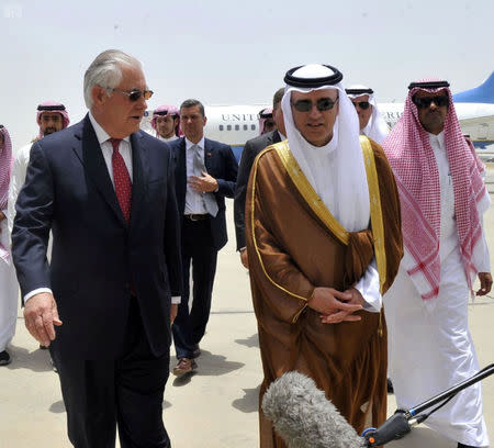 Saudi Foreign Minister Adel al-Jubeir welcomes U.S. Secretary of State Rex Tillerson in Jeddah, Saudi Arabia July 12, 2017. Saudi Press Agency/Handout via REUTERS