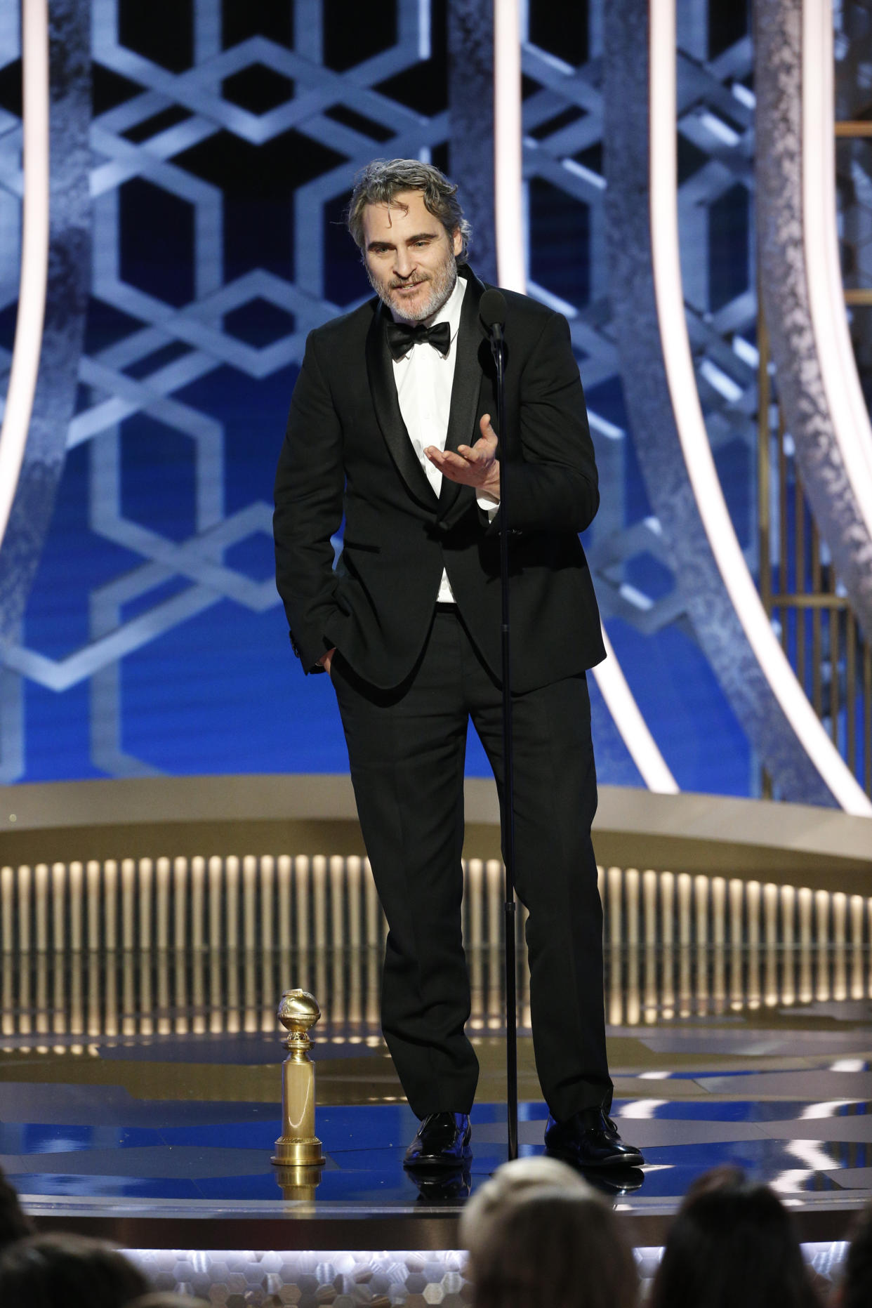 BEVERLY HILLS, CALIFORNIA - JANUARY 05: In this handout photo provided by NBCUniversal Media, LLC,  Joaquin Phoenix accepts the award for BEST PERFORMANCE BY AN ACTOR IN A MOTION PICTURE - DRAMA for "Joker" onstage during the 77th Annual Golden Globe Awards at The Beverly Hilton Hotel on January 5, 2020 in Beverly Hills, California. (Photo by Paul Drinkwater/NBCUniversal Media, LLC via Getty Images)