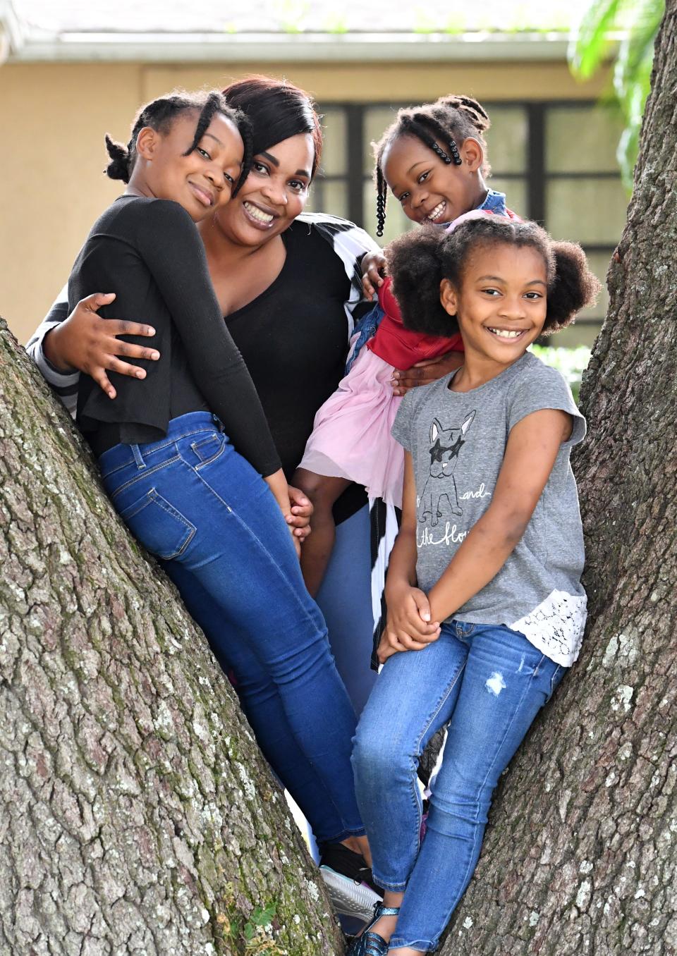 Katie Dore with her daughters, from left, Ta-nyia, 10; Elaya, 4; and Mckayla, 8, at her mother's home in Ellenton. Dore, has applied for an apartment in Lofts on Lemon in downtown Sarasota.