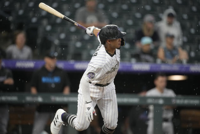 Colorado Rockies' Ezequiel Tovar watches his single off Miami Marlins relief pitcher Huascar Brazoban that drove in the winning run in the ninth inning of a baseball game Thursday, May 25, 2023, in Denver. (AP Photo/David Zalubowski)