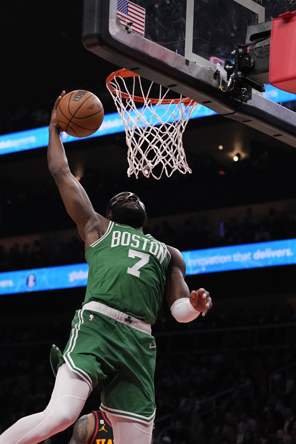 Boston Celtics guard Jaylen Brown (7) shoots and scores against the Atlanta Hawks during the second half of Game 3 of a first-round NBA basketball playoff series, Friday, April 21, 2023, in Atlanta. (AP Photo/Brynn Anderson)