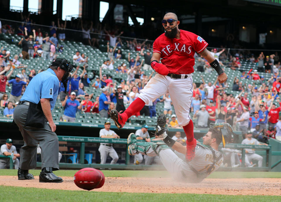 Texas Rangers' Rougned Odor (12) reacts after stealing home in the eighth inning against the Oakland Athletics on Sunday, June 9, 2019 in Arlington, Texas. (Richard W. Rodriguez/Fort Worth Star-Telegram/TNS via Getty Images)