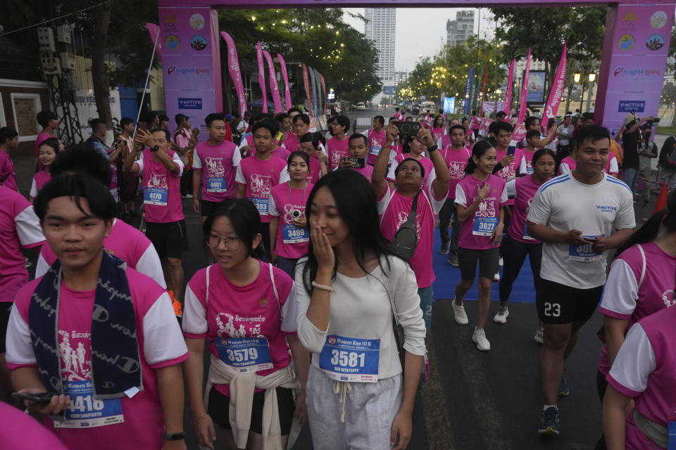 CORRECTS PLACE - Cambodians attend a running event called "Women of Victory" to mark the International Women's Day at at a public park in Phnom Penh Cambodia, Friday, March 8, 2024. (AP Photo/Heng Sinith)
