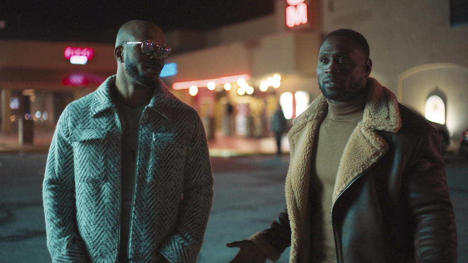 This image provided by Bounce shows Deji LaRay, left, and Thomas Q. Jones in a scene from "Johnson," which premieres Aug. 1, 2021, on Bounce TV. (DeWayne Rogers/Bounce via AP)