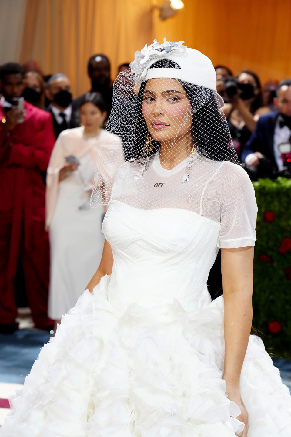 Kylie stands on the red carpet while looking to her side