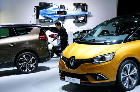 FILE PHOTO: A worker cleans a Renault car at the European Motor Show in Brussels, Belgium, January 13, 2017. REUTERS/Francois Lenoir/File Photo