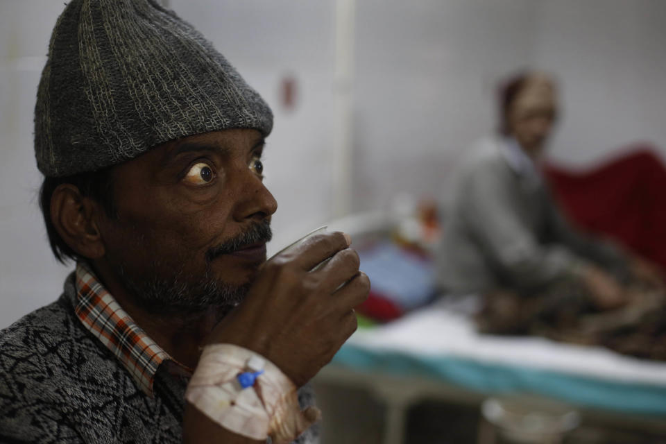 In this Sunday, Feb. 2, 2014 photo, an unidentified patient suffering from tuberculosis sips tea while sitting on his bed at Lal Bahadur Shastri Government Hospital at Ram Nagar in Varanasi, India. India has the highest incidence of TB in the world, according to the World Health Organization's Global Tuberculosis Report 2013, with as many as 2.4 million cases. India saw the greatest increase in multidrug-resistant TB between 2011 and 2012. The disease kills about 300,000 people every year in the country. (AP Photo/Rajesh Kumar Singh)