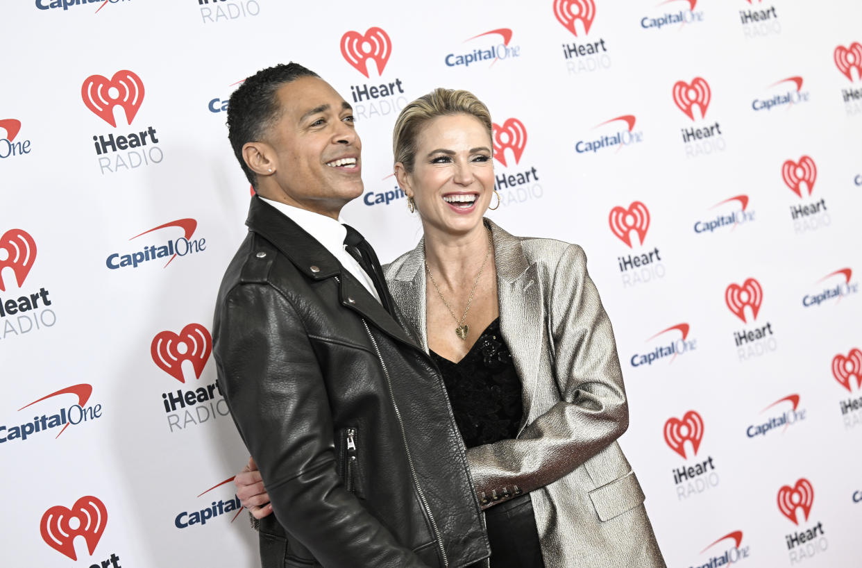 T.J. Holmes, left, and Amy Robach arrive at the iHeartRadio Jingle Ball at Madison Square Garden in NYC.