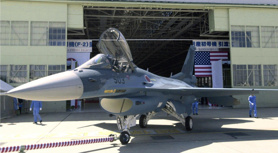 FILE - In this Sept. 25, 2000, file photo, a Japan Air Self-Defense Forces F-2 jet fighter is seen in Toyoyamacho, Aichi Prefecture (state), central Japan. Japan's Cabinet approved a ninth straight increase in the nation's defense budget as the government bolsters funding to develop longer-range cruise missiles and stealth fighters to counter potential threats from China and North Korea. (Kyodo News via AP, File)