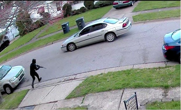 Akron police released this image taken in April, 2022, in the 1400 block of Rockaway Street in Summit Lake, where Teyaurra L. Harris, 21, died of a gunshot wound to the head. Police said the individual in black was firing shots at a group of people in front of a home down the road. Harris, who was pregnant, had been a passenger in a car. A 16-year-old boy and men ages 18, 20 and 21 were charged with multiple felonies in her death.