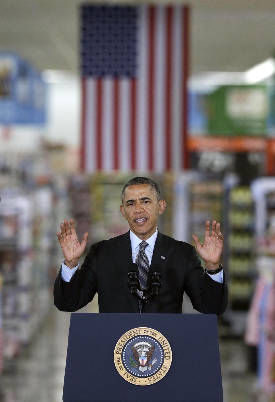 President Barack Obama speaks at a Walmart store in Mountain View, Calif., Friday, May 9, 2014. Obama announced new steps by companies, local governments and his own administration to deploy solar technology, showcasing steps to combat climate change that don't require consent from a disinclined Congress. (AP Photo/Jeff Chiu)