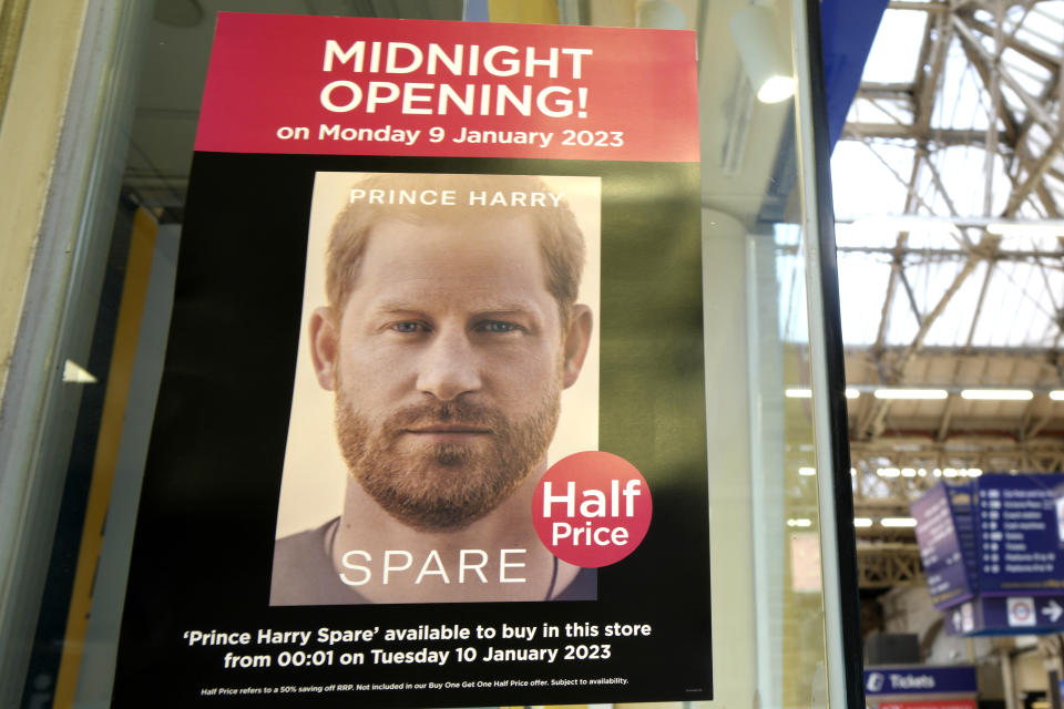 A poster advertises the midnight opening of a store to sell the new book by Prince Harry called 'Spare' in London, Monday, Jan. 9, 2023. Prince Harry has defended his memoir that lays bare rifts inside Britain's royal family. He says in TV interviews broadcast Sunday that he wanted to "own my story" after 38 years of "spin and distortion" by others. Harry's soul-baring new memoir, "Spare," has generated incendiary headlines even before its release. (AP Photo/Kirsty Wigglesworth)