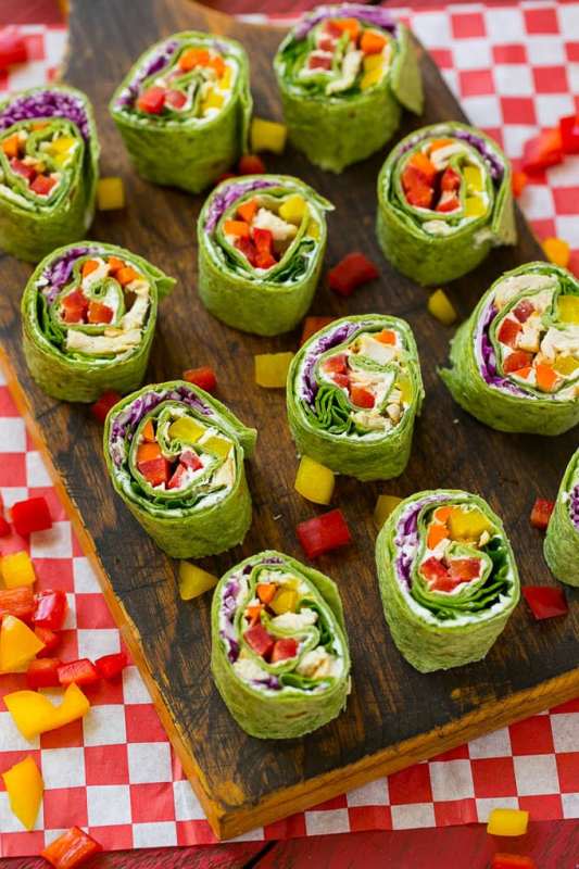 <p>Dinner at the Zoo</p><p>These veggie pinwheels are a rainbow of colorful fresh veggies with ranch flavored cream cheese, all rolled up inside a spinach tortilla wrap.</p><p><strong>Get the recipe: <a href="https://www.dinneratthezoo.com/rainbow-veggie-pinwheels-sesame-lime-quinoa-salad/" rel="nofollow noopener" target="_blank" data-ylk="slk:Rainbow Veggie Pinwheels;elm:context_link;itc:0;sec:content-canvas" class="link rapid-noclick-resp"><em>Rainbow Veggie Pinwheels</em></a></strong></p>