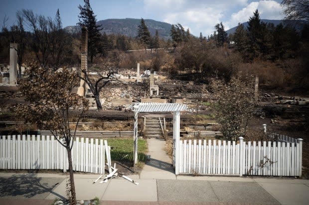 Damaged structures are seen in Lytton, B.C., on July 9 after a wildfire destroyed most of the village on June 30. (Darryl Dyck/The Canadian Press - image credit)